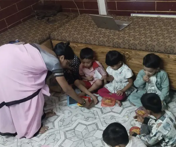 Volunteer distributing meals to children