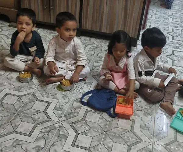Children enjoying meals during a support activity